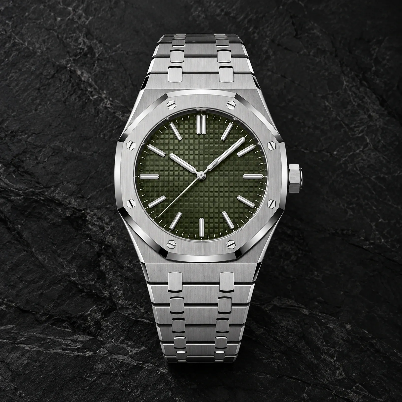 Front view of a stainless steel luxury sports watch with khaki green textured dial and integrated steel bracelet on a dark stone background.